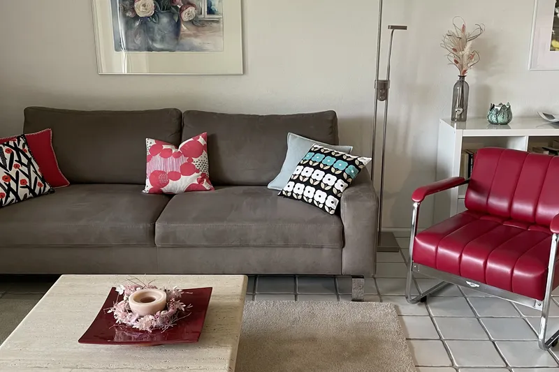 Living room with sofa and armchair