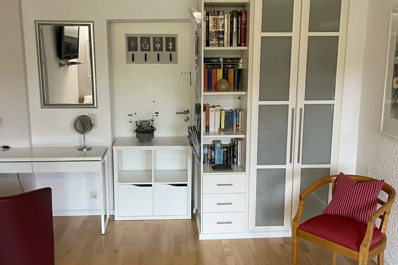 Living area with fitted units and shelves